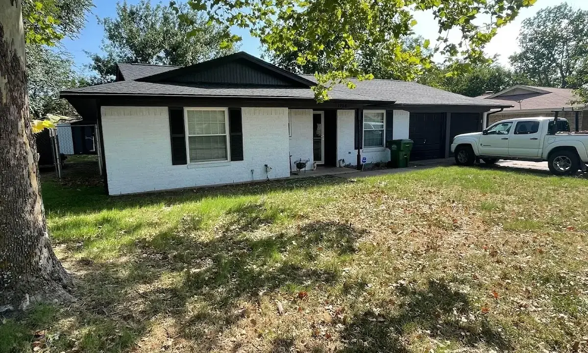 Professional roofing crew working on a residential roof in Windcrest
